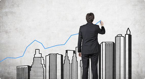 A man sketching a graph on a wall - Big Catch Consulting