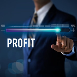 A businessman pointing at a profit line - Big Catch Consulting