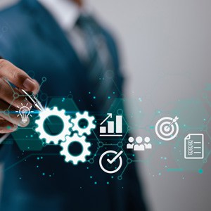 A businessman's hand interacts with a virtual interface - Big Catch Consulting